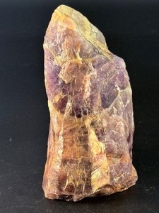 lot 50 image: Raw Chevron Amethyst showcases the stone in its natural, unpolished form, highlighting bold V-shaped bands of deep purple amethyst and milky white quartz.&nbsp2 lbs 7.3 oz.  1.115 kg.