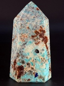 lot 59 image: Amazonite Tower is a beautifully polished crystal tower that showcases the soothing, turquoise-green hues of amazonite, often accented with natural striations and subtle white veining. &nbsp1 lb 1.1 oz.  0.486 kg.