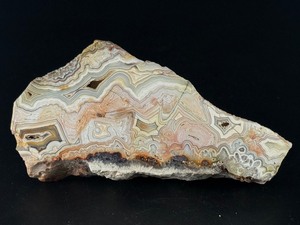 lot 66 image: Laguna Lace Agate (Partial Polished) is a striking natural piece that beautifully balances raw texture with smooth, polished detail. 1 lb 1.9 oz.  0.508 kg.