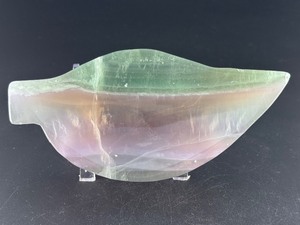 lot 73 image: Fluorite Leaf Dish is a hand-carved crystal piece shaped like a delicate leaf bowl, showcasing the natural banding and vibrant colors of fluorite.13.6 oz.  0.388 kg.