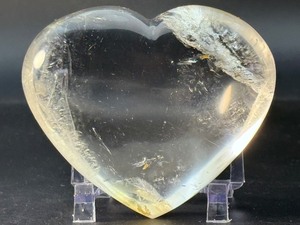 lot 79 image: Natural Clear Quartz Puffy Heart with inclusions is a charming, hand-polished crystal carved into a soft, rounded heart shape. 14.1 oz.  0.399 kg.