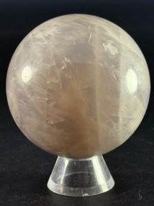 lot 80 image: Blue Quartz Sphere is a polished crystal sphere that showcases the calming, ethereal beauty of blue quartz. 15.3 oz.  0.436 kg.