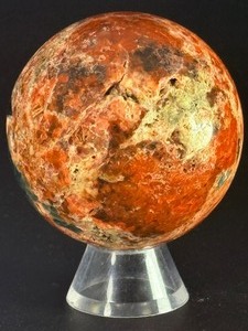 lot 82 image: Sunstone and Blue Apatite Sphere is a striking crystal sphere that combines the warm, radiant energy of sunstone with the calming, deep blue tones of apatite.&nbsp10.6 oz.  0.302 kg.