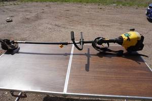 lot 64 image: MTD Yard Machines Gas Powered Weed Trimmer