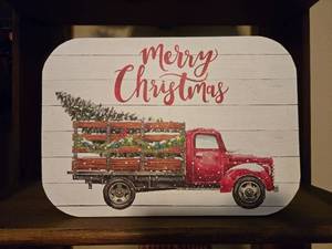 lot 38 image: Red and White Striped Holiday Metal Storage Tin with Christmas Lid