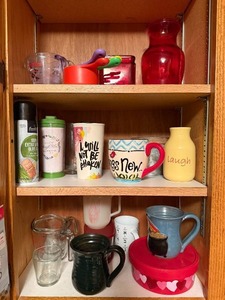 lot 107 image: Assorted Kitchenware Collection with Mugs, Measuring Cups, and More