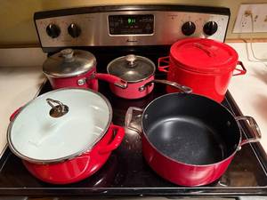lot 126 image: Set of Red Cookware Pots and Pans by KitchenAid and Farberware