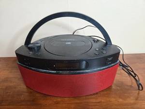 lot 181 image: Insignia Portable CD Player with Red Speaker Base