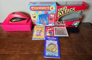 lot 246 image: Collection of UNO Games, Connect 4, and Wee Sing Songs Books