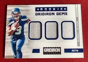 lot 96 image: 2012 Gridiron Russell Wilson Triple Swatch Rookie Card - #d199