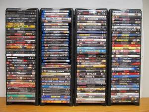 lot 40 image: Large Lot of DVDs in Nice Tower Stands - 140