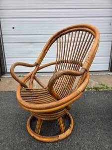lot 127 image: Larger Mid Century Rattan Swivel Lounge Chair