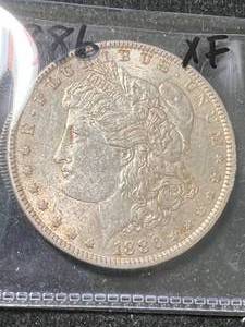 lot 32 image: 1886 US MORGAN SILVER DOLLAR XF