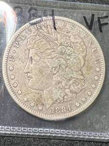 lot 42 image: 1884 US MORGAN SILVER DOLLAR VF