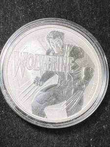 lot 64 image: 1 TROY OZ .9999 FINE SILVER 2021 WOLVERINE ROUND IN AIRTITE