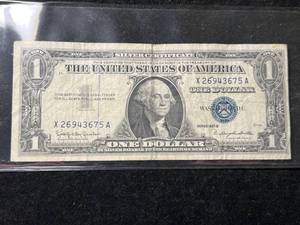 lot 99 image: 1957B US BLUE SEAL $1 SILVER CERTIFICATE