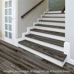 lot 28 image: 8 Boxes of Cap A Tread White 47 in. Length x 12 in. Deep x 7-38 in. Height Stair Riser Laminate Trim to be Used with Cap A Tread  Customer Returns See Pictures