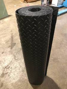 lot 9 image: Workforce Black 36 in. x 20 ft. Vinyl Diamond Plate Commercial Floor Mat Customer Returns See Pictures