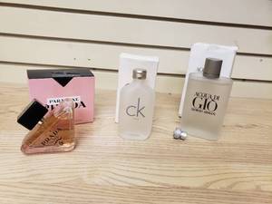 lot 26 image: Bottle of Prada Paradoxe Perfume, CK One 3.4 oz EDT by Calin K perfume, and Giorgio Armani Acqua DI Gio perfume