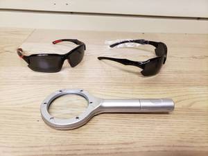 lot 42 image: 2 pairs of sunglasses and a lighted magnifying glass
