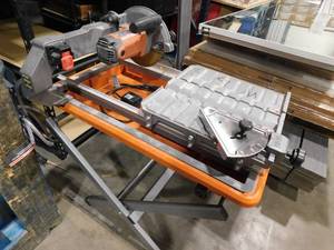 lot 537 image: Used---RIDGID 9-Amp 7 in. Blade Corded Wet Tile Saw with Stand