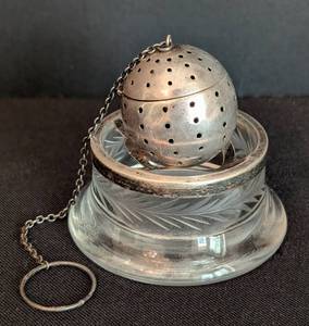 lot 212 image: Sterling Silver Tea Ball and Crystal Holder