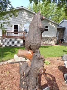 lot 11 image: Bears on tree carving