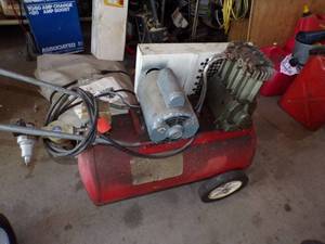 lot 25 image: Red Air Compressor for parts