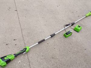 lot 86 image: Cordless Greenworks Pole  Tree Trimmer