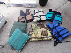 lot 104 image: Life Jackets and boat cushions