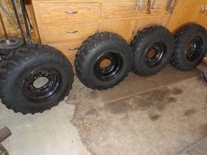 lot 150 image: Set of 4 New Tires and Rims 25x10-12 for 4 Wheeler