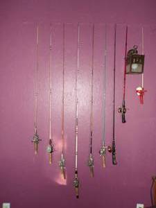 lot 322 image: Vintage Fishing Poles on Wall