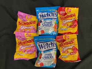 lot 10 image: BB1 - Assortment of Starburst Gummies and Welchs Fruit Snacks