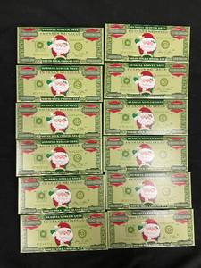 lot 31 image: QQ1 - Set of 12 Russell Stover Solid Milk Chocolate Santa Bars