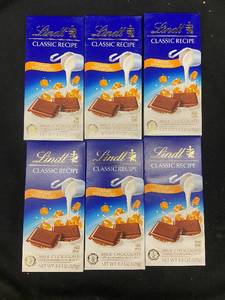 lot 102 image: LL2 - Collection of 6 Lindt Milk Chocolate Caramel With Sea Salt 4.4 oz Bars