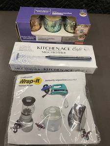 lot 28 image: Better Homes & Gardens Outdoor Candles, KitchenAce Milk Frother & Wrap-It Storage Straps Set