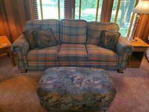 Beautiful Couch and Love Seat with pillows and Ottoman with a Rustic Wildlife Feel