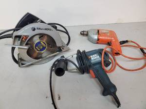 lot 85 image: 3 Black and Decker Hand Tools Skill Saw and 2 Drills
