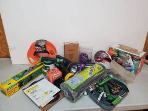 lot 102 image: Unused Straps With Garden Supplies and Flashlights