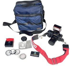 lot 342 image: Canon T50 Camera and Accessories Bundle