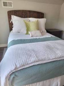 lot 14 image: Pottery Barn Mocha Raffia Full Headboard