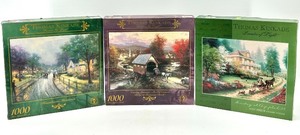 lot 180 image: Set of 3 Thomas Kinkade Puzzles - 1000 Piece Each