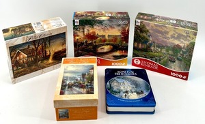 lot 211 image: Collection of 5 Thomas Kinkade Puzzles & Tin Box Set