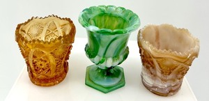 lot 217 image: Set of 3 Glass Votive Holders in Amber, Green, and Beige including Slag Glass