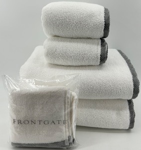 lot 252 image: Set of White Frontgate Towels with Resort Border Trim