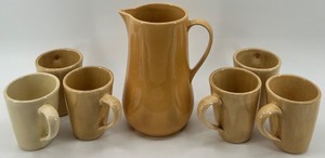 lot 274 image: Pottery Barn Handmade Pitcher and Mug Set - 7 Pieces