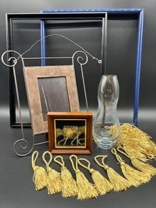 lot 109 image: Set of Home Decor Items Glass Vase, Frames, Wall Hanging, and Tassels
