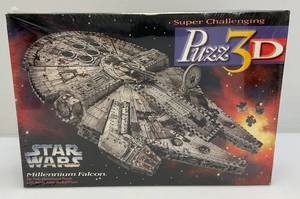 lot 162 image: Vintage STAR WARS Millennium Falcon 3D Puzzle (Factory Sealed)