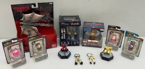 lot 170 image: Misc. Vintage Collectible Action Figures Including Aliens,  Stranger Things And More (NIB)