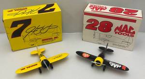 lot 211 image: Vintage Miniature NASCAR Die-Cast Airplane Banks Including Number 7 & 28 (NIB)